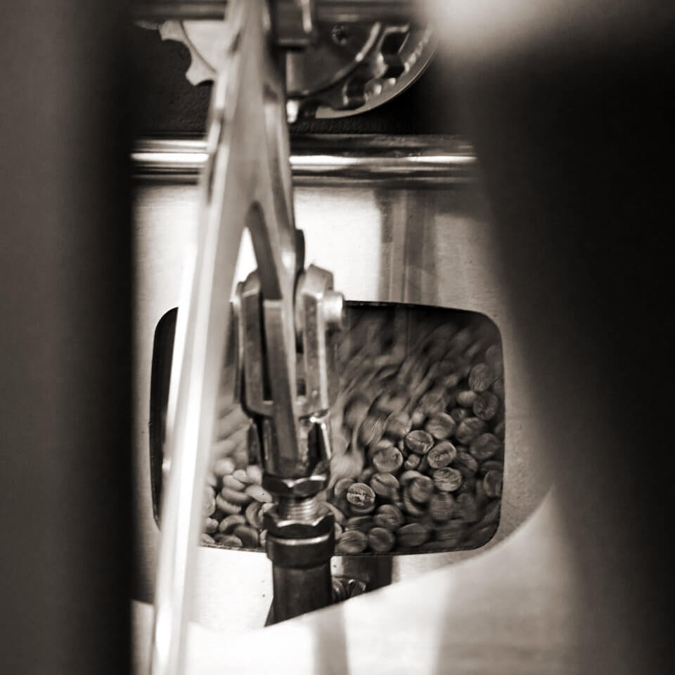 An abstract image of the roasting machine as it roasts a batch of coffee.